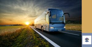 Tour bus driving down highway at sunset signifies two North Carolina casino bus junkets